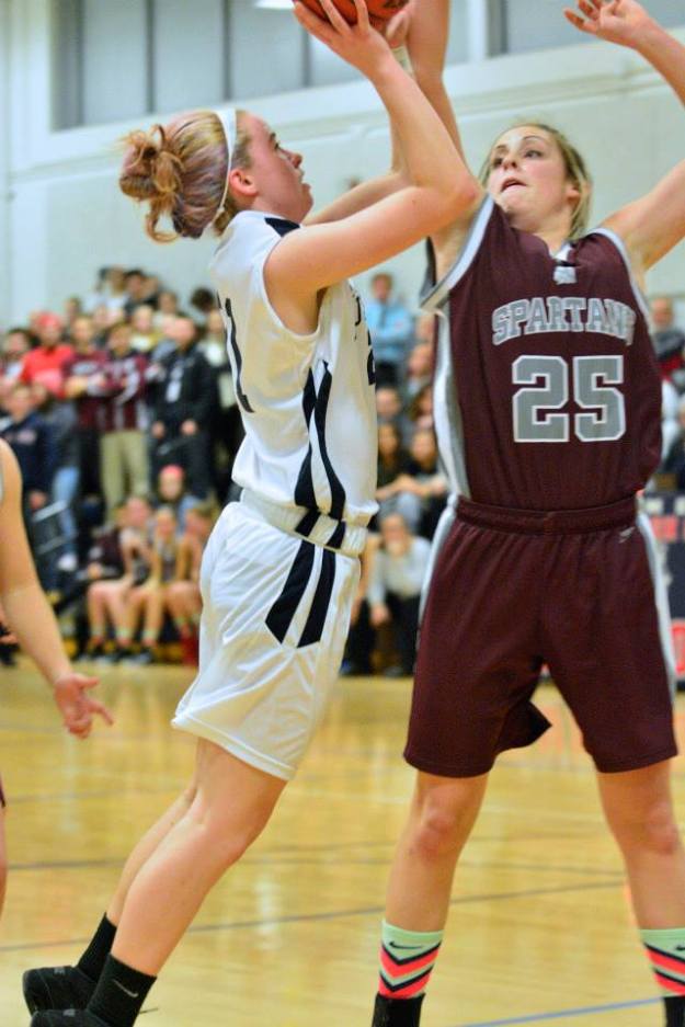 Sophomore Maddie Olsen gets to the hoop against Stang.